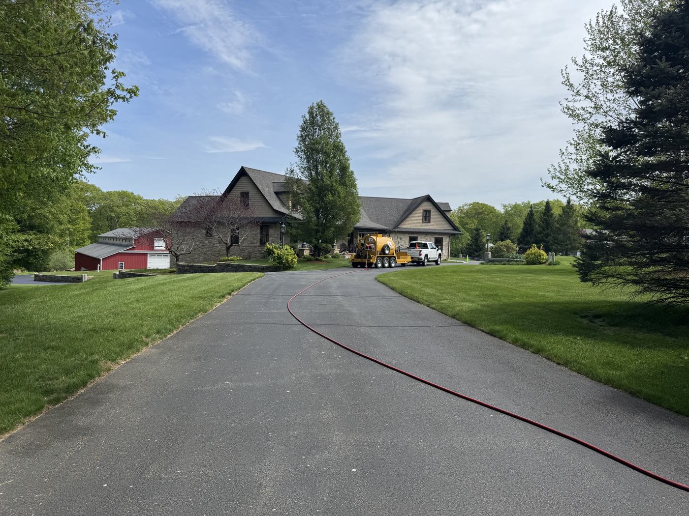 Sealcoated driveway at a well-kept suburban home