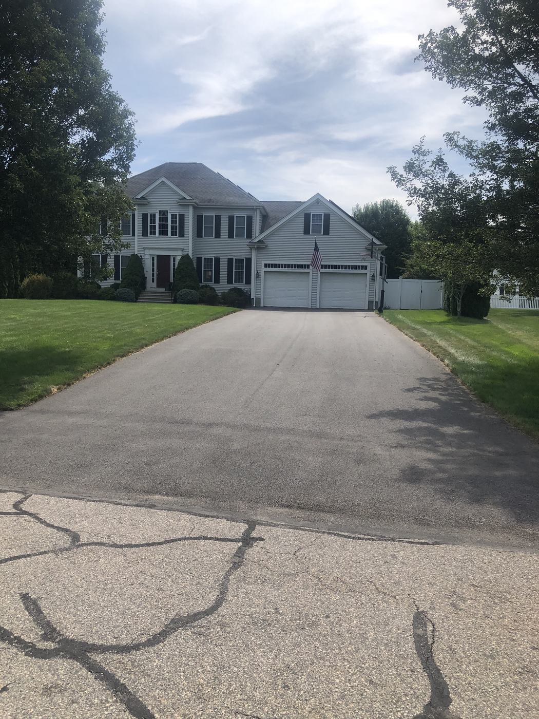 Driveway sealcoating completed at a single-family home